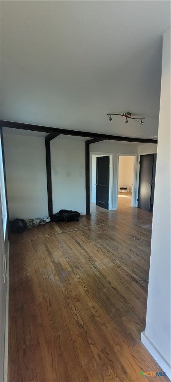 empty room featuring wood-type flooring