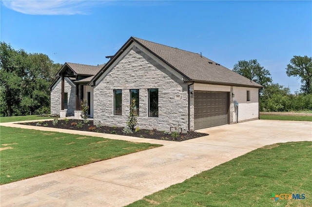644 Creekside Dr, Belton, TX 76513 - view of front of home featuring a front lawn, concrete driveway, a garage, stone siding, and a shingled roof