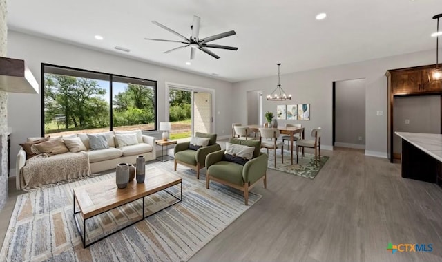 644 Creekside Dr, Belton, TX 76513 - living area with light wood-style flooring, baseboards, ceiling fan, a chandelier, and recessed lighting