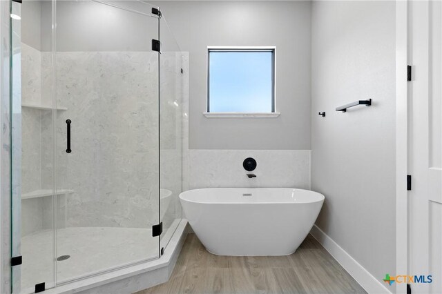 644 Creekside Dr, Belton, TX 76513 - bathroom featuring a freestanding tub, a shower stall, and wood finished floors