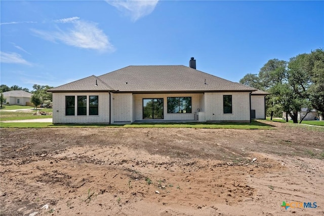 644 Creekside Dr, Belton, TX 76513 - rear view of property featuring a chimney and brick siding