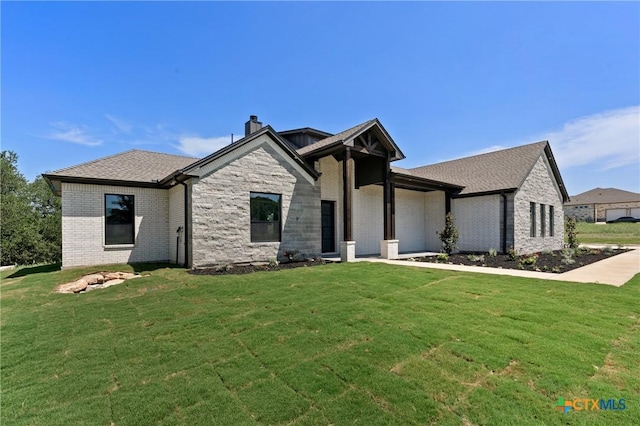 644 Creekside Dr, Belton, TX 76513 - view of front of house with a front lawn, a chimney, brick siding, and an attached garage
