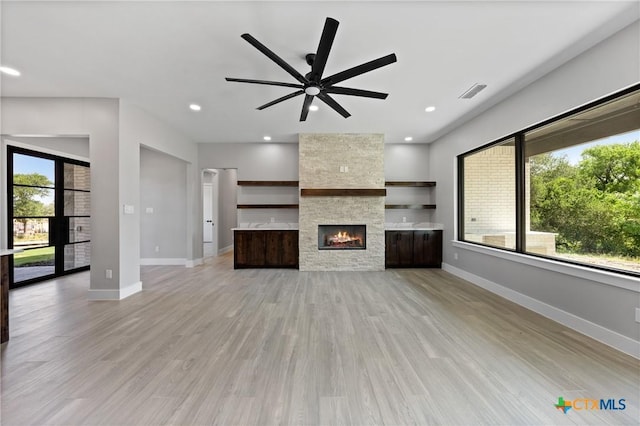 644 Creekside Dr, Belton, TX 76513 - unfurnished living room featuring ceiling fan, baseboards, light wood finished floors, recessed lighting, and a fireplace