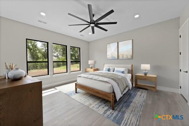 644 Creekside Dr, Belton, TX 76513 - bedroom featuring wood finished floors, baseboards, recessed lighting, and ceiling fan