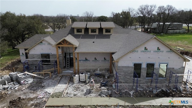 property under construction with a chimney