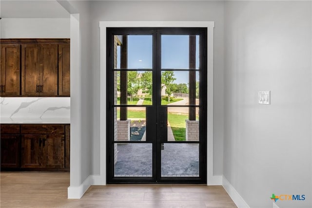 644 Creekside Dr, Belton, TX 76513 - doorway to outside with light wood-style flooring, baseboards, and french doors
