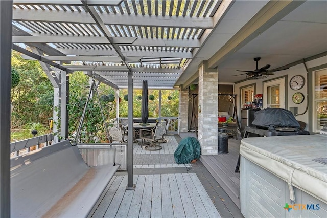 wooden terrace with ceiling fan and a pergola