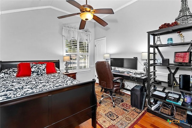 bedroom featuring crown molding, vaulted ceiling, ceiling fan, and light hardwood / wood-style floors