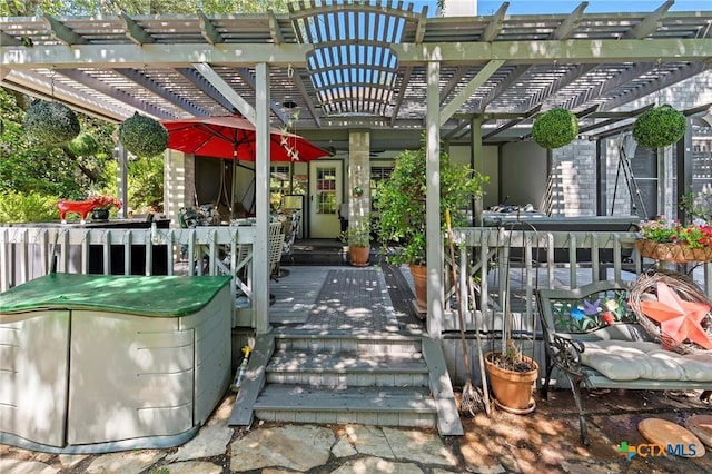 view of patio / terrace featuring a pergola and a deck