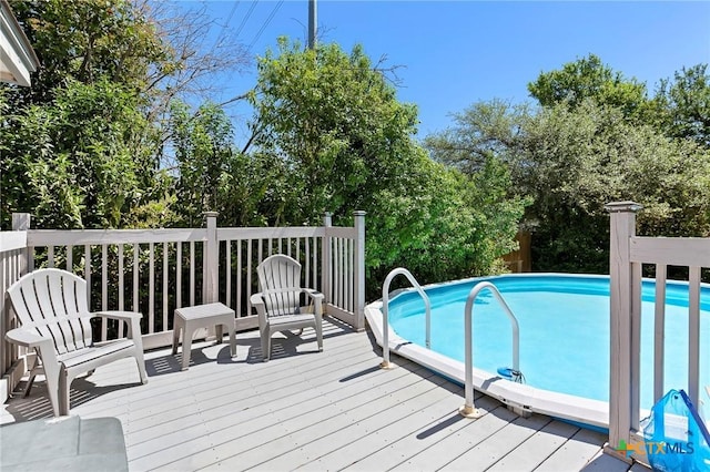 swimming pool with a wooden deck