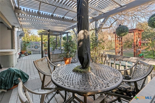 view of patio / terrace featuring a wooden deck and a pergola