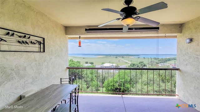 balcony featuring ceiling fan