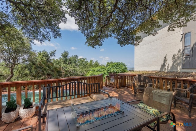 deck with an outdoor fire pit