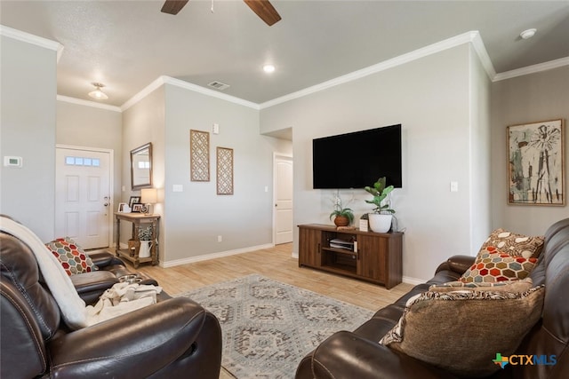 living room with ornamental molding, light wood-type flooring, and ceiling fan