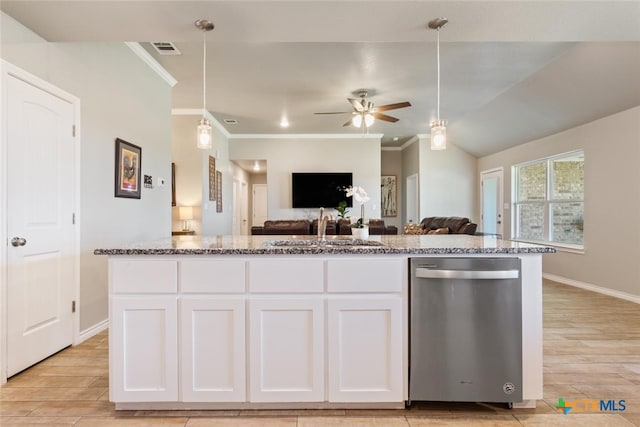 kitchen featuring sink, stainless steel dishwasher, hanging light fixtures, light hardwood / wood-style flooring, and white cabinets