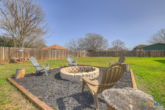 view of yard with an outdoor fire pit and a fenced backyard