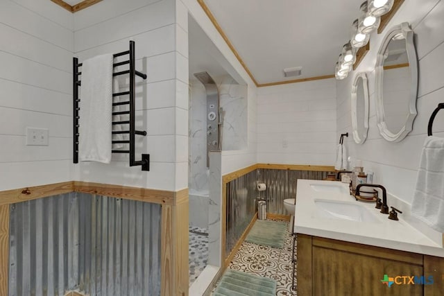 full bathroom with double vanity, walk in shower, a sink, and toilet