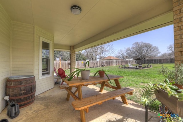 view of patio featuring outdoor dining area and a fenced backyard