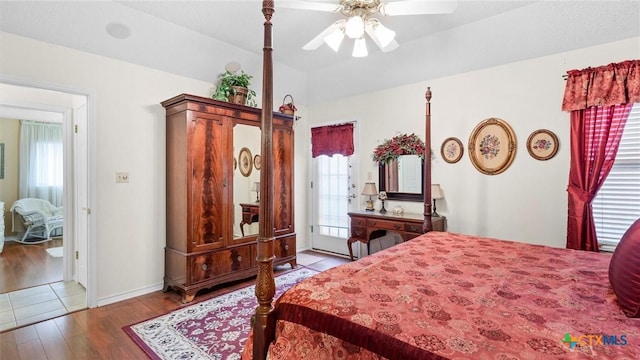 bedroom with access to exterior, baseboards, a ceiling fan, and wood finished floors