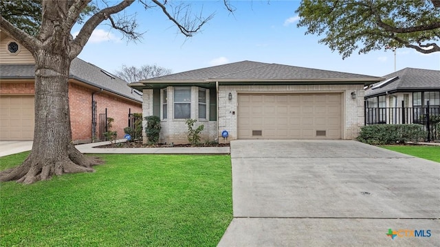 view of front facade with a garage, driveway, brick siding, and a front lawn