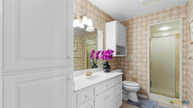 full bath featuring toilet, a stall shower, wallpapered walls, and vanity