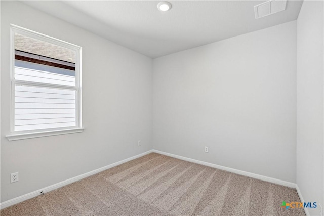 spare room with carpet floors