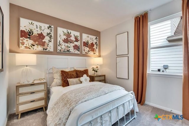 carpeted bedroom with multiple windows