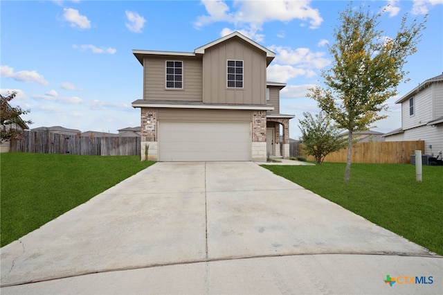 view of front of home with a garage and a front lawn