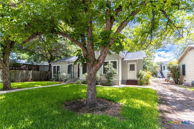 view of front of property with a front lawn