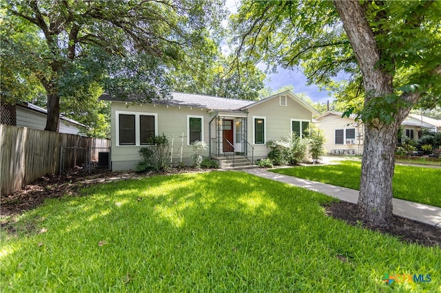 ranch-style house with a front lawn