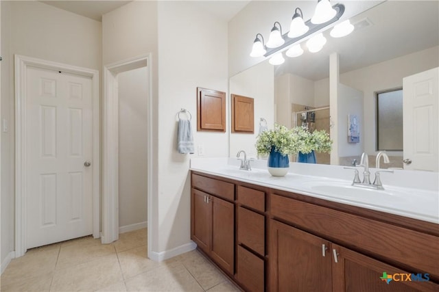 bathroom with vanity and tile patterned floors