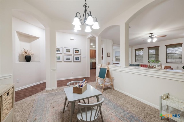 living area with wood-type flooring and ceiling fan