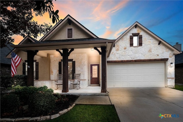 view of front of house with a garage and covered porch