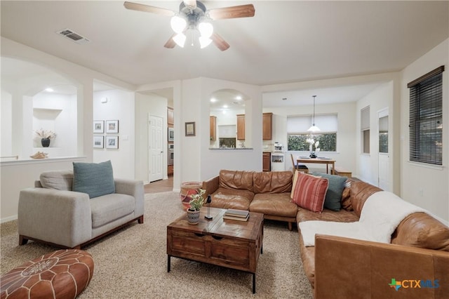 living room featuring sink and ceiling fan