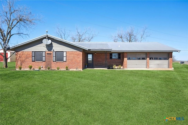 ranch-style house with an attached garage, brick siding, and a front yard