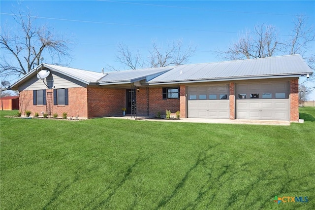 single story home featuring metal roof, a garage, brick siding, driveway, and a front yard