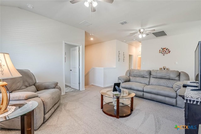 carpeted living room featuring vaulted ceiling and ceiling fan