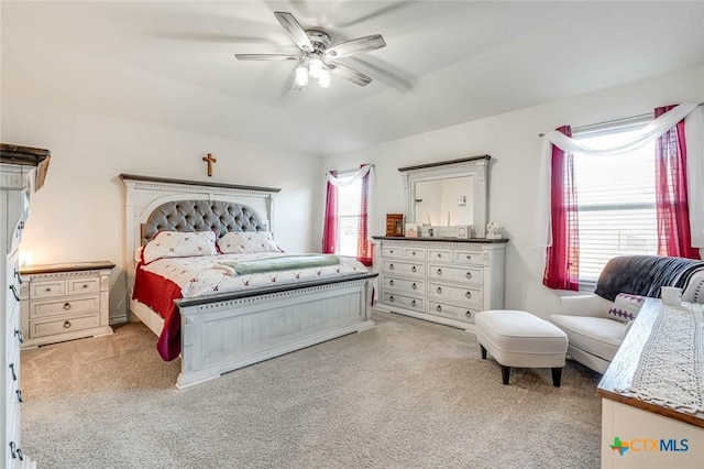 carpeted bedroom featuring ceiling fan