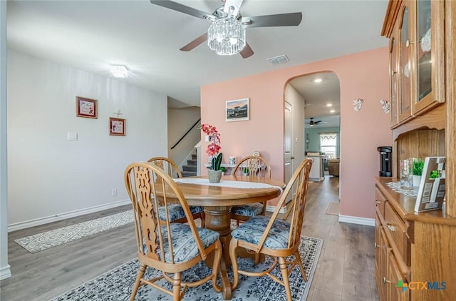 dining space featuring hardwood / wood-style flooring and ceiling fan