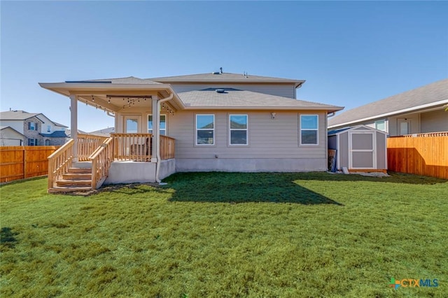 back of property featuring a storage unit and a lawn