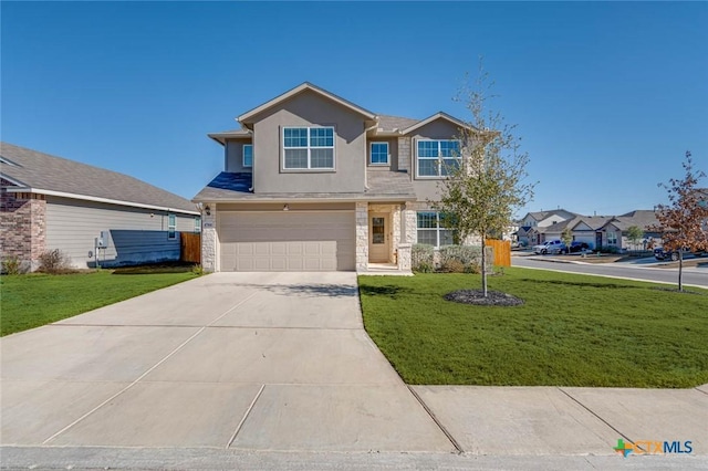 view of front of house with a garage and a front lawn