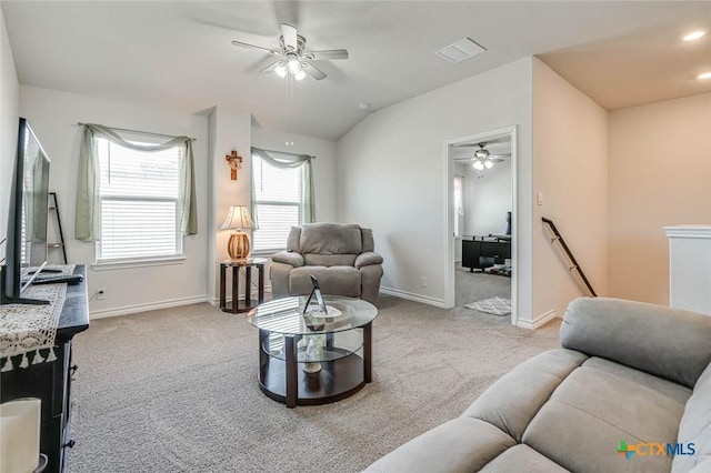 living room with lofted ceiling, light colored carpet, and ceiling fan