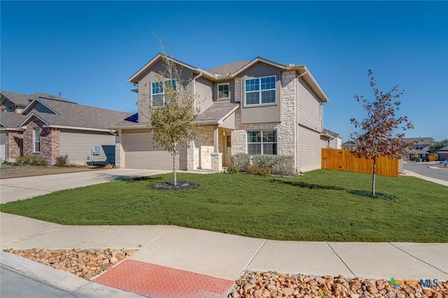 view of front facade with a garage and a front lawn