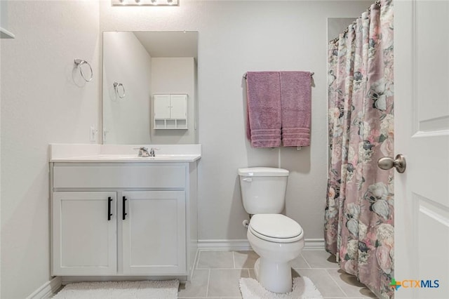 bathroom with walk in shower, tile patterned floors, vanity, and toilet