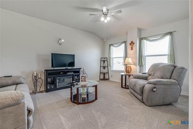 carpeted living room featuring lofted ceiling and ceiling fan