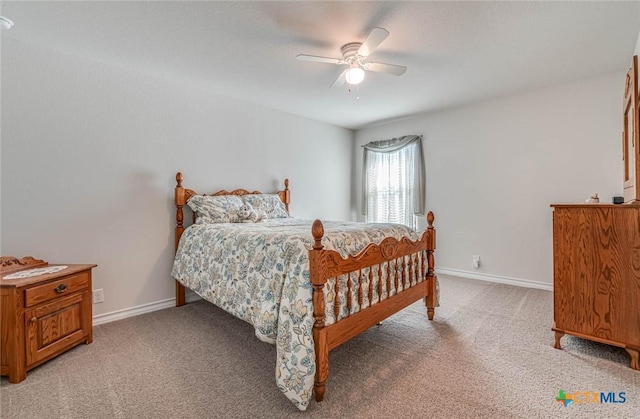 bedroom featuring light carpet and ceiling fan