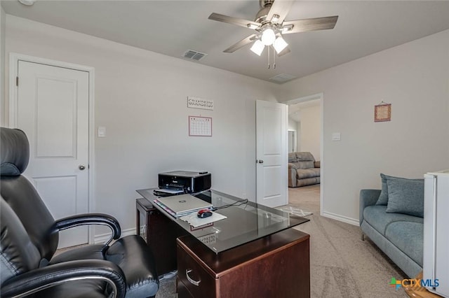 office featuring light colored carpet and ceiling fan