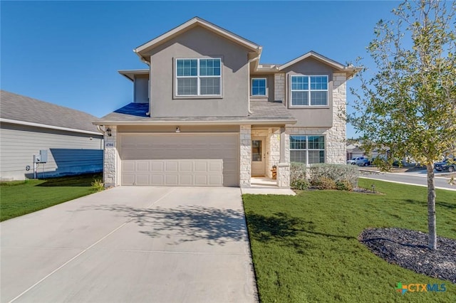 view of front of house featuring a garage and a front lawn