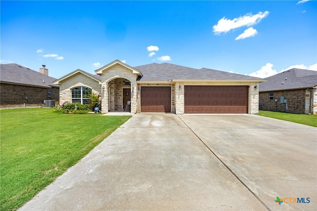 1211 Liberation Ln, Copperas Cove, TX 76522 - ranch-style home with a front lawn, stone siding, driveway, and an attached garage
