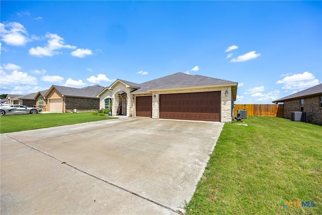 1211 Liberation Ln, Copperas Cove, TX 76522 - ranch-style house with stone siding, an attached garage, and driveway
